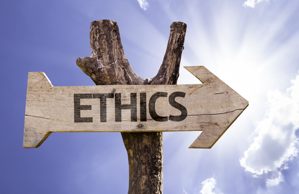 Ethics wooden sign on a beautiful day